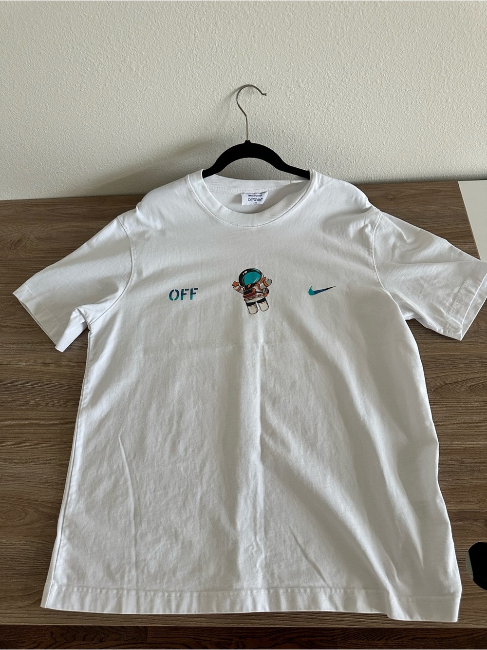 Off-White White Short Sleeve Tee with Teal Astronaut and Logo
